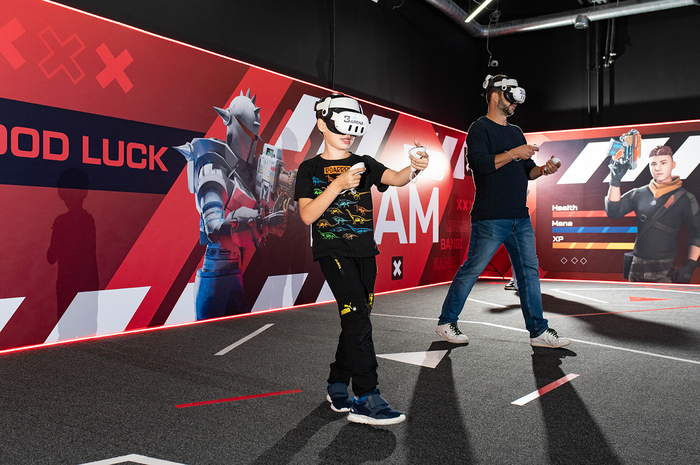 Players enjoying free-roam VR in the Pointe Noir arena